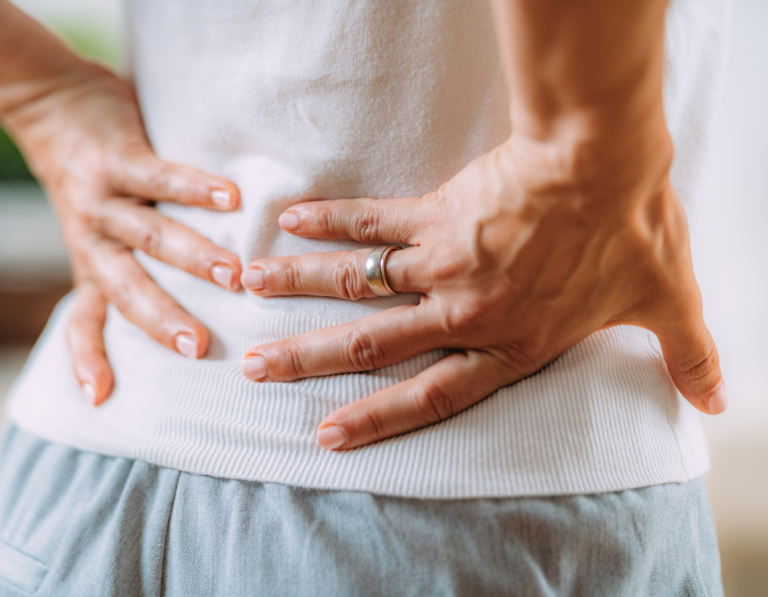 a woman experiencing lower back pain